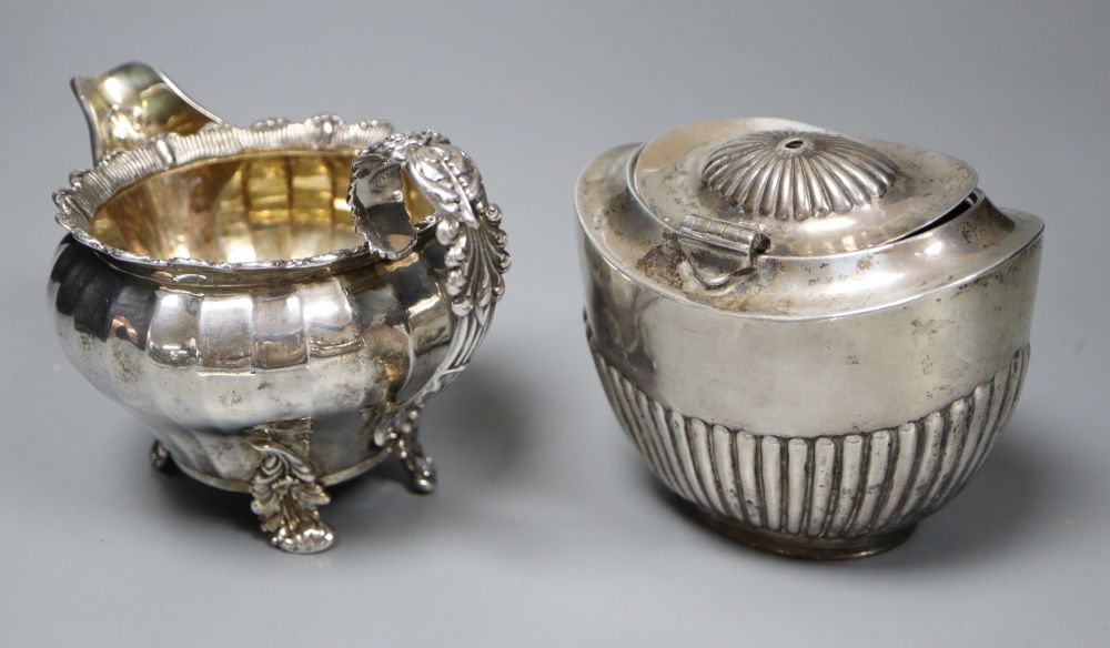 A George IV silver cream jug, London 1823 and an oval half-fluted tea caddy, approx 15oz